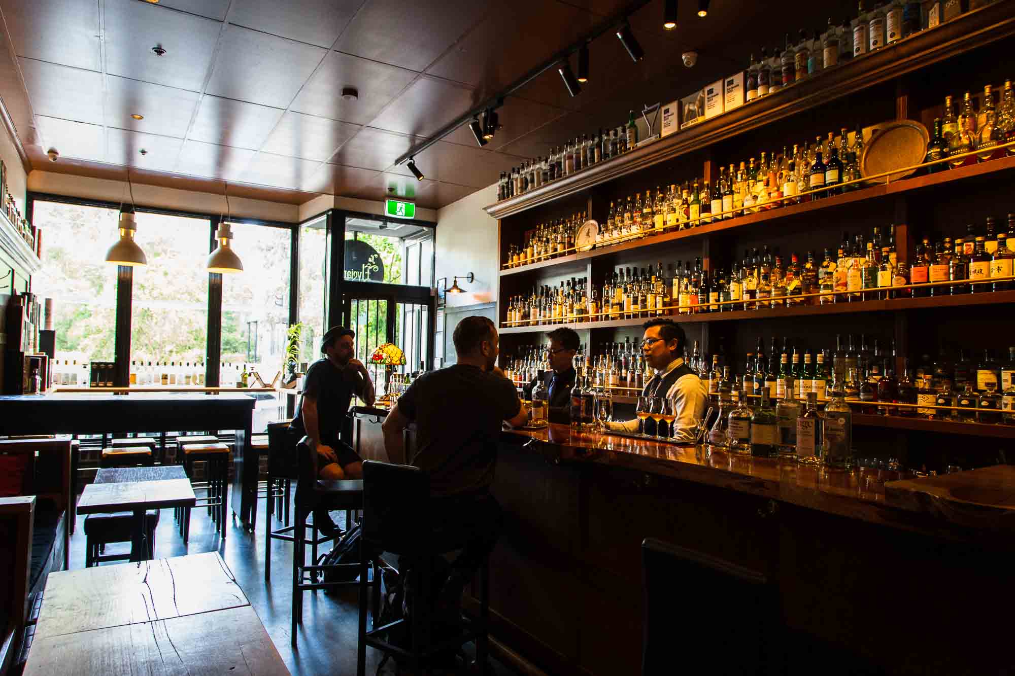 Behind the bar, Kelvin Low (left) and Yao Wong lead an impromptu tasting for their guests. Photo: Boothby