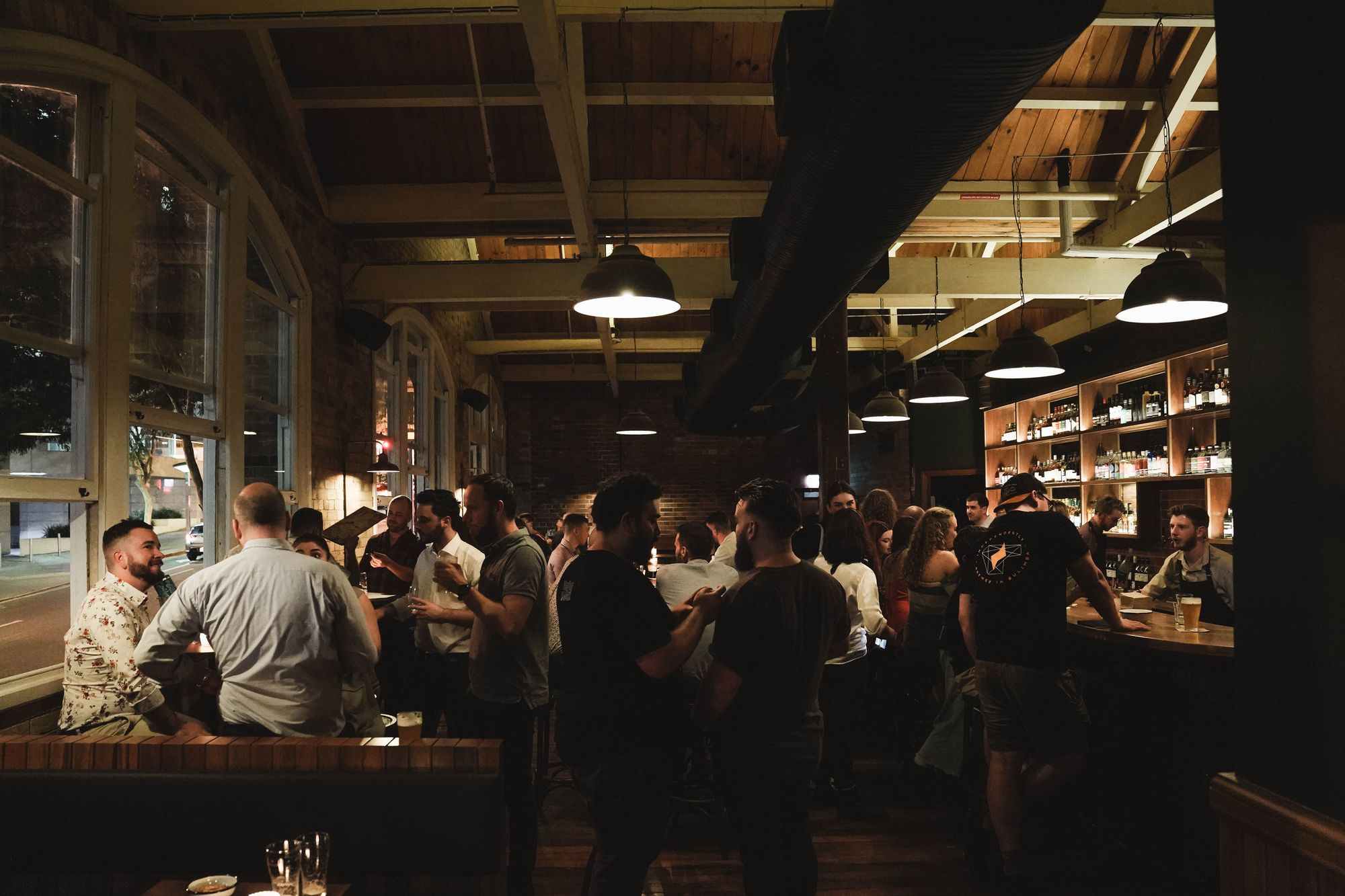 The high ceiling and large ach windows make for a dramatic room at Frog's Hollow Saloon. Photo: Supplied