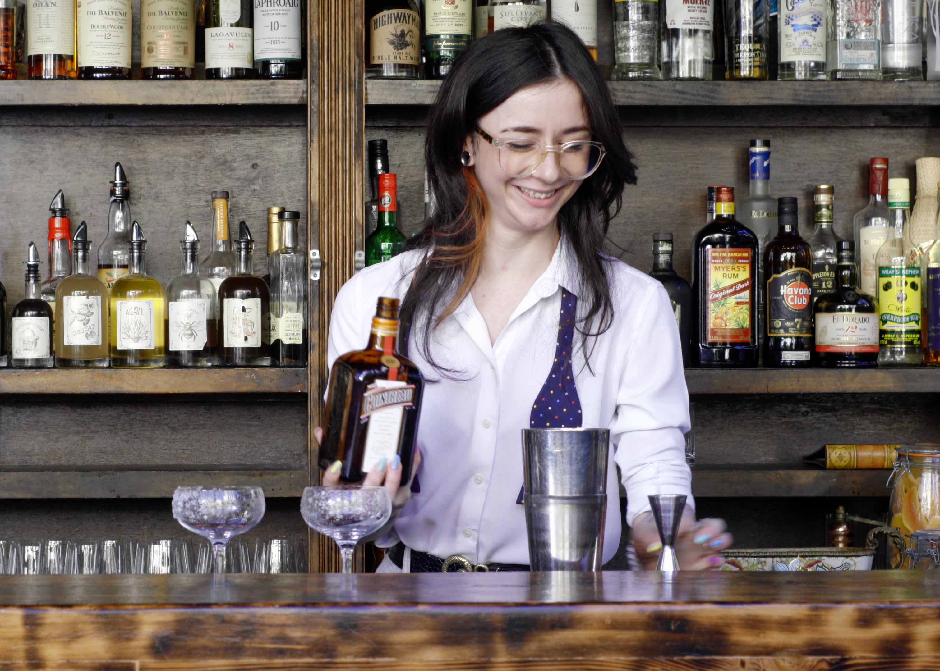 Sarah Mycock behind the bar on the roof at Old Mate's Place. Photo: Boothby