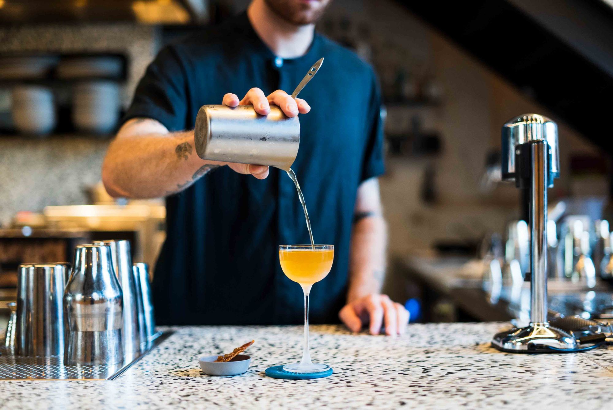 The Chicken cocktail at Re comes with an edible garnish of crispy chicken skin. Photo: Boothby