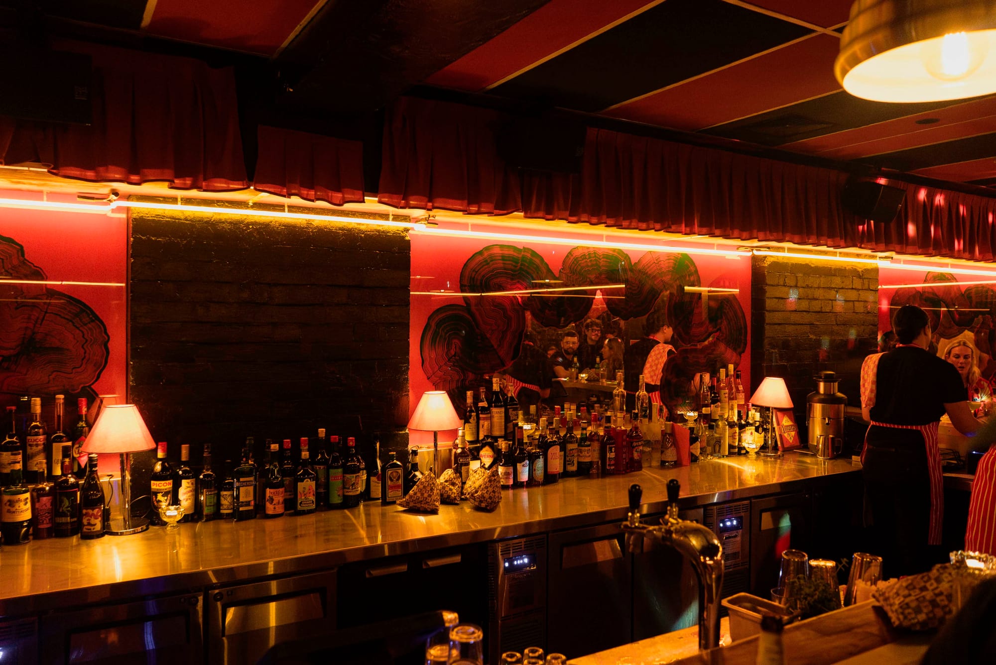 The back bar is broken up with mirror panels. Photo: Boothby