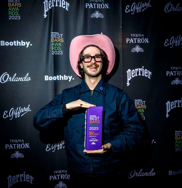 Harrison Kenney picking up the trophy for Best New Bar NSW presented by Tequila Patrón. Photo: Christopher Pearce